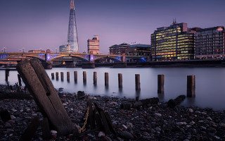 City skyline bridge river mountains - rich moody colour free wallpaper