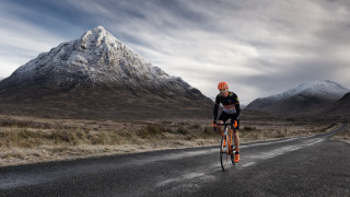 Mountain road bike sunset ocean - peak in the background free wallpaper for desktop