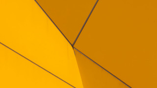 Yellow wall metal wire clock - a yellow wall free wallpaper for desktop