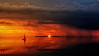 Sailboat sunset storm mystical colors - a storm free wallpaper