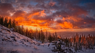 Sunset snowy mountain trees clouds 2 - a sunset over a snowy mountain free wallpaper