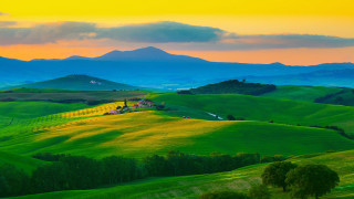 Green field mountains sunset house - a yellow sky free wallpaper