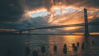 Bridge water sky clouds cityscape - a body of water below free wallpaper
