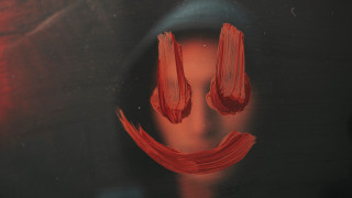 Red face black surface smile - a red face free wallpaper