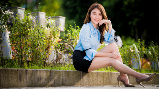 Woman sitting wall blue shirt - black skirt free wallpaper
