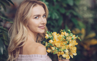 Woman yellow flowers smiling outdoors - yellow flower free wallpaper for desktop