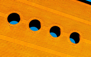 Wall holes blue sky macro - a close up of a wall free wallpaper