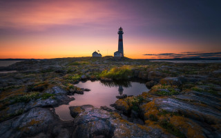 Lighthouse rocky shore sunset pond 3 - denis eden free wallpaper