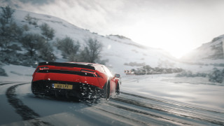 Red sports car snowy mountains 2 - a snowy road free wallpaper