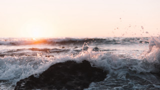 Wave rock sunset ocean beach - a rock in the ocean free wallpaper