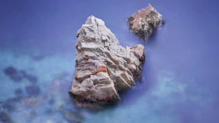 Rock formation water blue sky - a rock formation free wallpaper for desktop