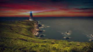 Lighthouse cliff ocean night red - a red sky above free wallpaper