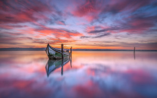 Boat water sunset dock mystical - a pink sky in the background free wallpaper