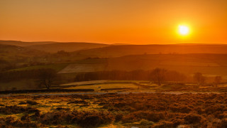 Sunset hilly countryside horse distant - a horse free wallpaper for desktop