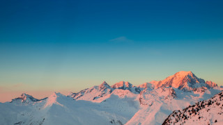 Mountain range snowy horizon sunset - a few snow covered mountains free wallpaper