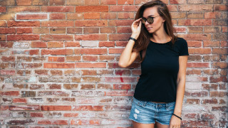 Woman black shirt shorts brick - her head and a hand free wallpaper