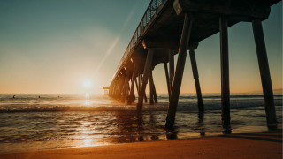 Pier sunset beach swimming people - a pier free wallpaper for desktop