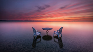 Beach sunset chairs table pink - a surrealist painting free wallpaper