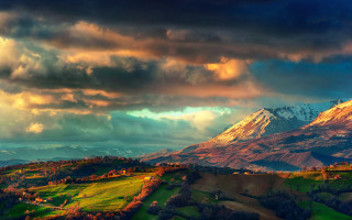 Mountain snow capped cloudy sky - mountain in the background free wallpaper