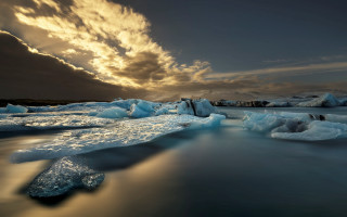 Icebergs water cloudy sky sunset - the water under a cloudy sky free wallpaper