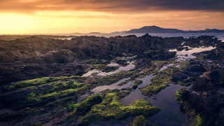 Rocky shore sunset island ocean - landscape free wallpaper for desktop