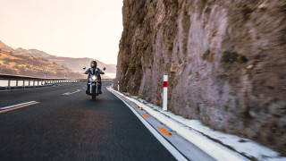 Motorcycle rider cliff water mountains - a person riding free wallpaper