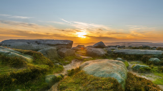 Sunset rocky landscape grass rocks - a few rock free wallpaper
