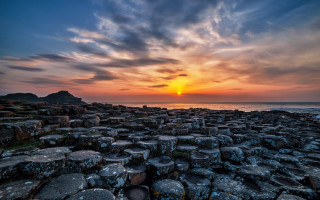 Sunset rocky beach cityscape water 2 - a rocky shore line free wallpaper