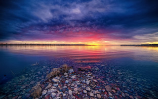 Sunset water rocks cloudy sky - arthur quartley free wallpaper