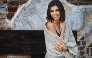 Woman blanket bench brickwall painting - a painting behind her free wallpaper