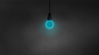 Glowing blue light bulb minimalist - a black cord free wallpaper