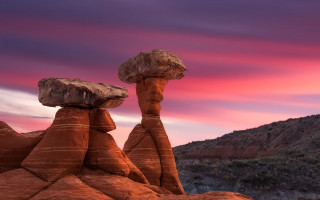 Pink sky rock formation mountain - a rock formation in the middle of it free wallpaper