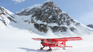 Red plane snow mountain sky - a sky background and a person free wallpaper