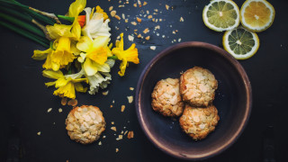 Plate lemons flowers vase stilllife - a plate of food free wallpaper