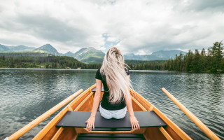 Woman boat lake mountains clouds - a boat free wallpaper for desktop