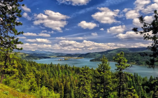 Lake mountains trees sky clouds - a scenic view of a lake free wallpaper