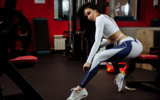 Woman squatting gym bench ball - full body pose free wallpaper for desktop