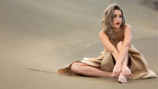 Woman beach towel sitting crossed - her knee free wallpaper for desktop