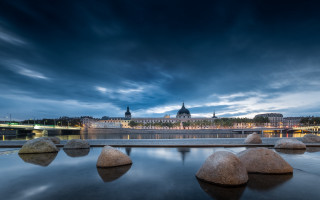 River rocks bridge city clouds - the water and a bridge in the background free wallpaper for desktop