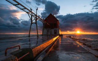 Red house pier ocean sunset - a red house free wallpaper