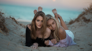 Two women sand relaxing blonde - their foot free wallpaper
