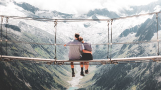 Suspension bridge man mountains hands - his head in his hands free wallpaper for desktop