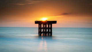Pier sunset water reflection tilt - top of a body free wallpaper