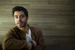 Man brown jacket posing arms - arte povera free wallpaper