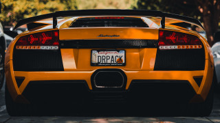 Yellow sports car parked license - a license plate free wallpaper for desktop