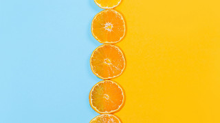 Orange slices yellow blue background - a blue border free wallpaper for desktop