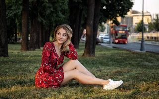 Woman sitting grass red dress - a red dress free wallpaper