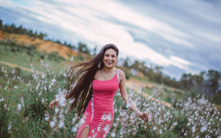 Pink dress woman flower field 2 - a field of flowers and grass free wallpaper