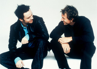 Two men sitting neo dada - a white background free wallpaper