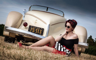Red haired woman sitting car - the grass next free wallpaper